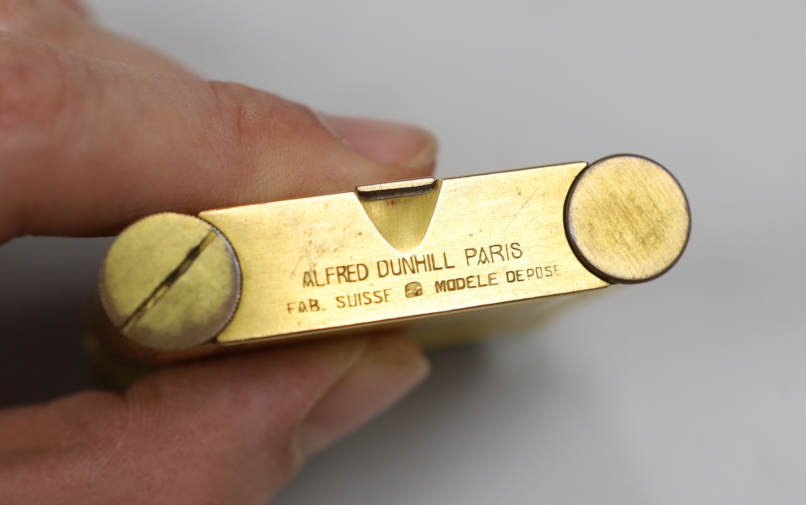 A gilt Dunhill compact / lipstick / cigarette lighter, 6cm with original box